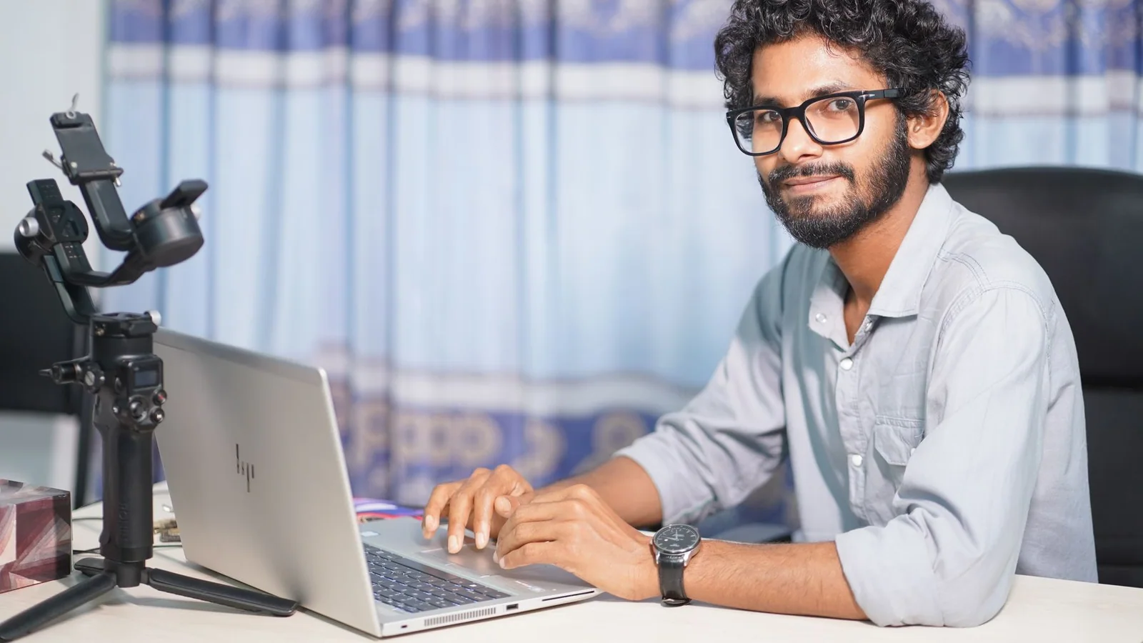 A technical professional continuing focused work at a laptop