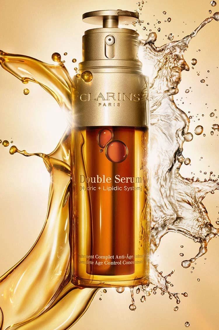 Premium serum product creative with golden liquid and glass details