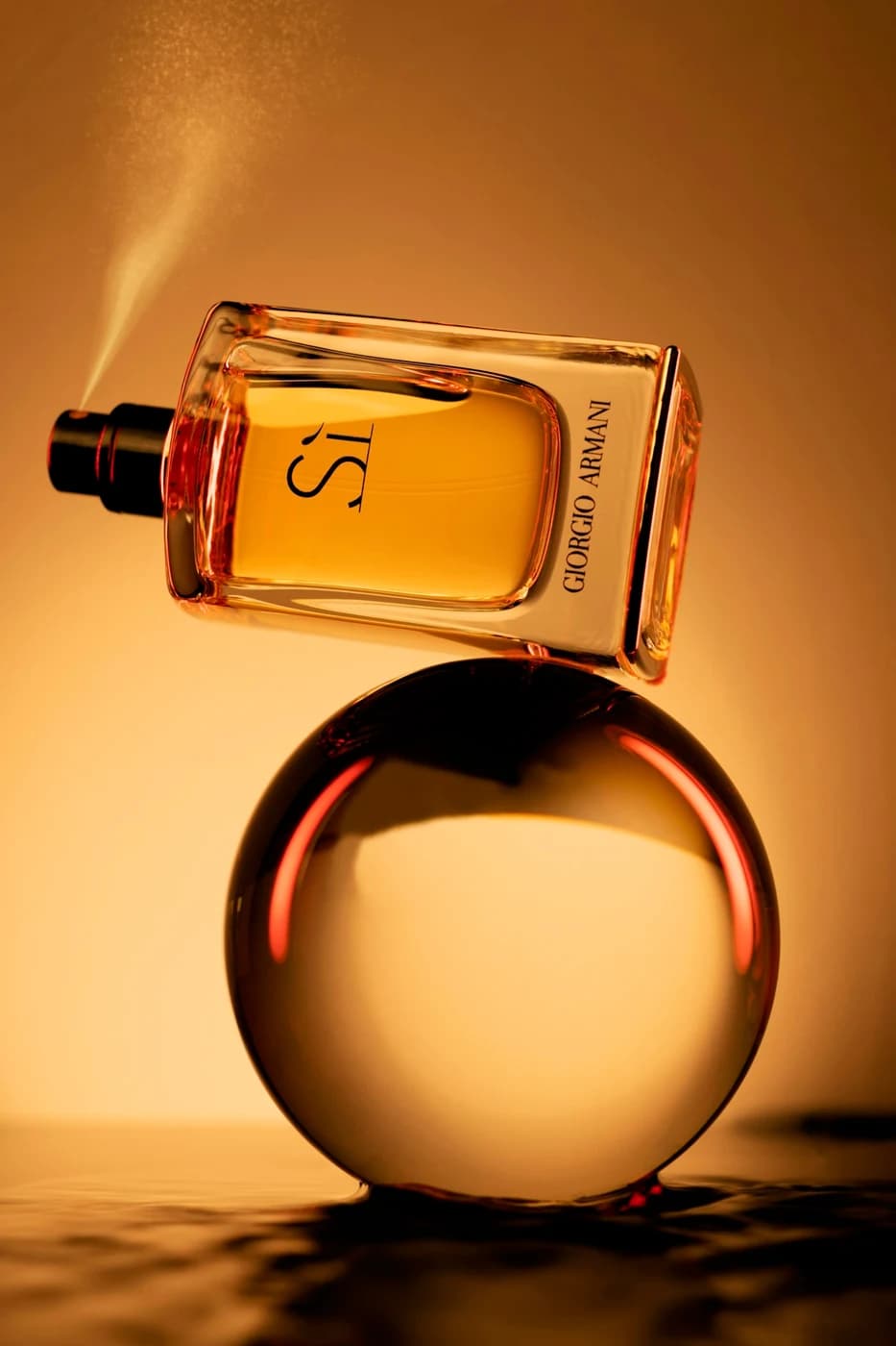 Giorgio Armani Si perfume in an orange-lit product composition